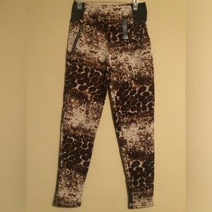 C-mode ankle cut pants in a stylish large-x-large animal print.
